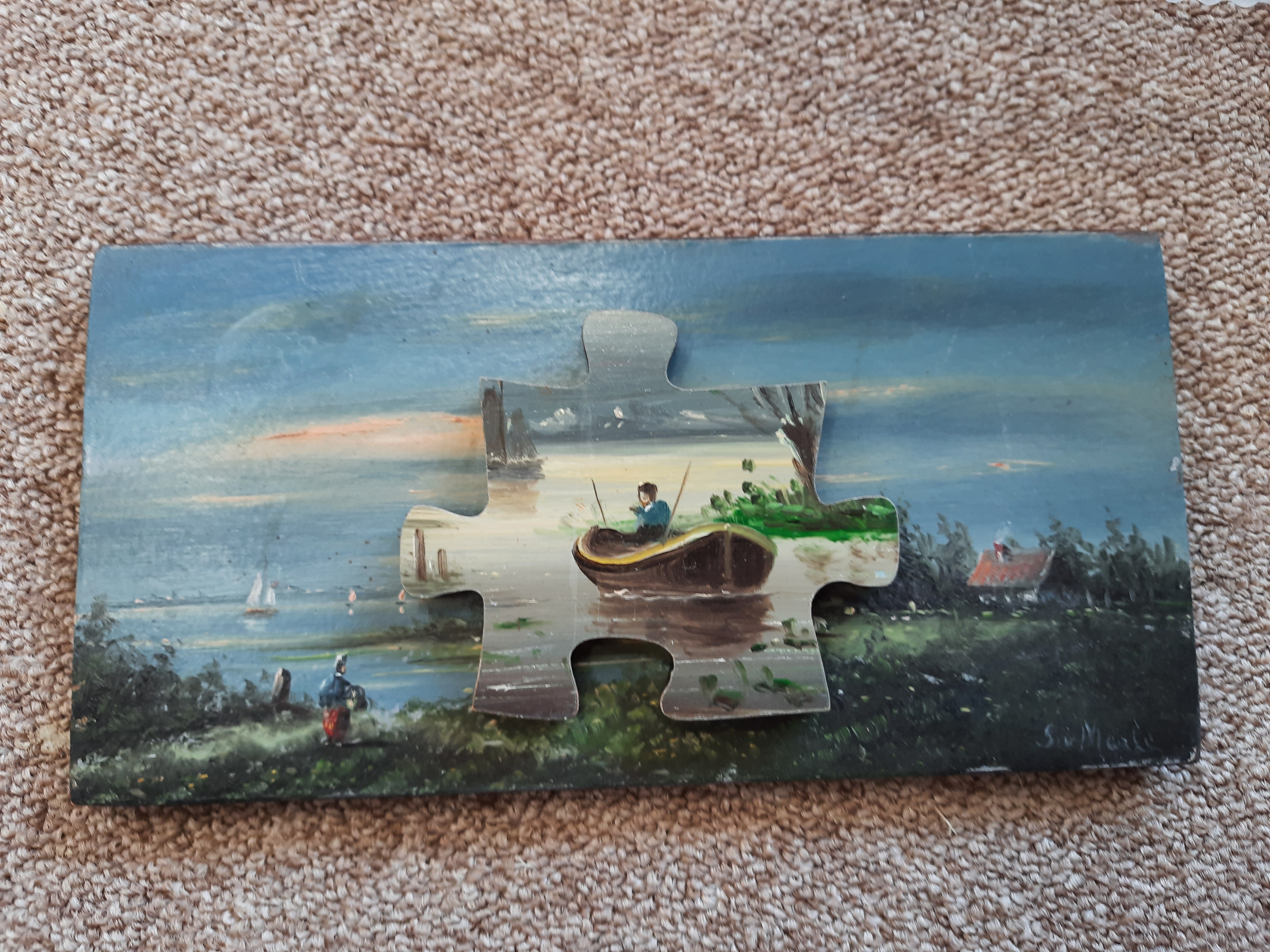 puzzelstuk gesneden uit een houten schilderijtje